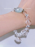 Bracelet with clear and mint beads on a wrist