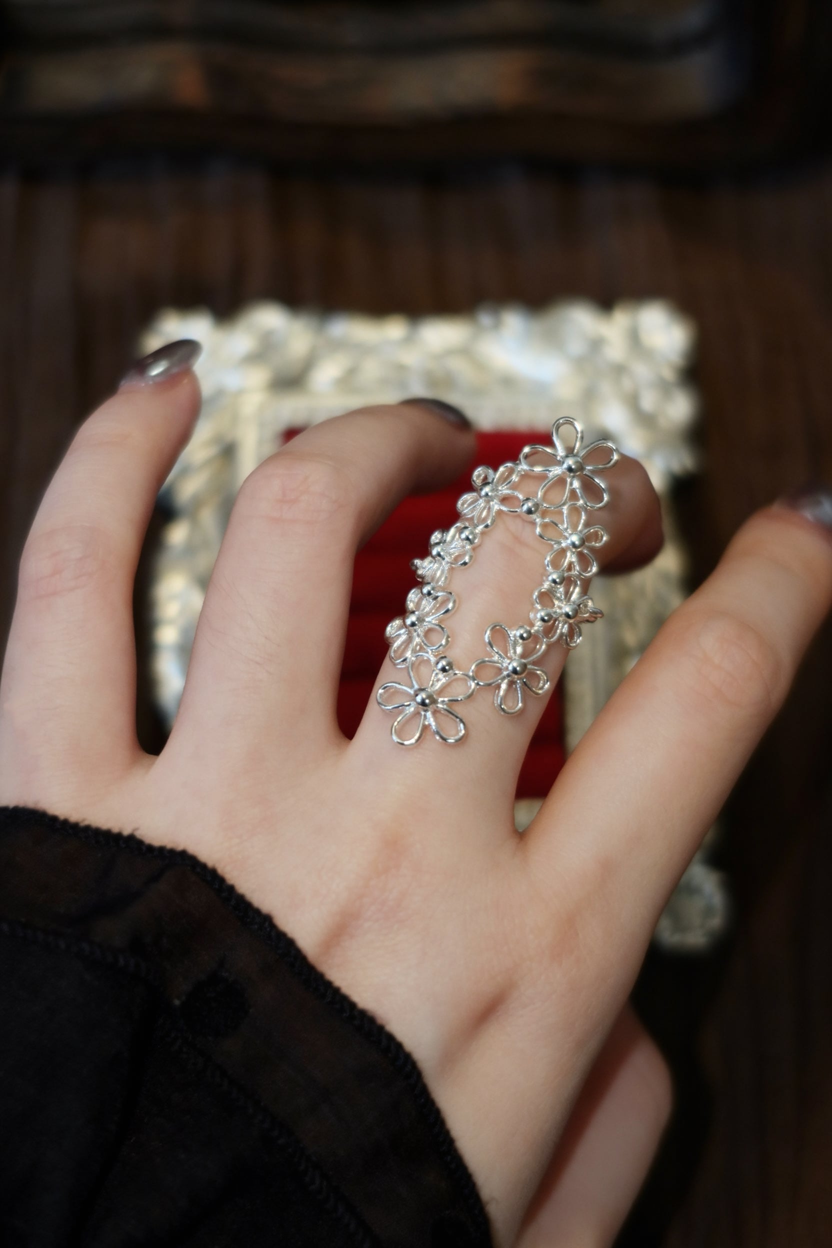 Close-up detail of the Interwoven Blooms oval filigree ring, highlighting the meticulous French vintage openwork craftsmanship and smoothly polished inner band for a comfortable knuckle fit